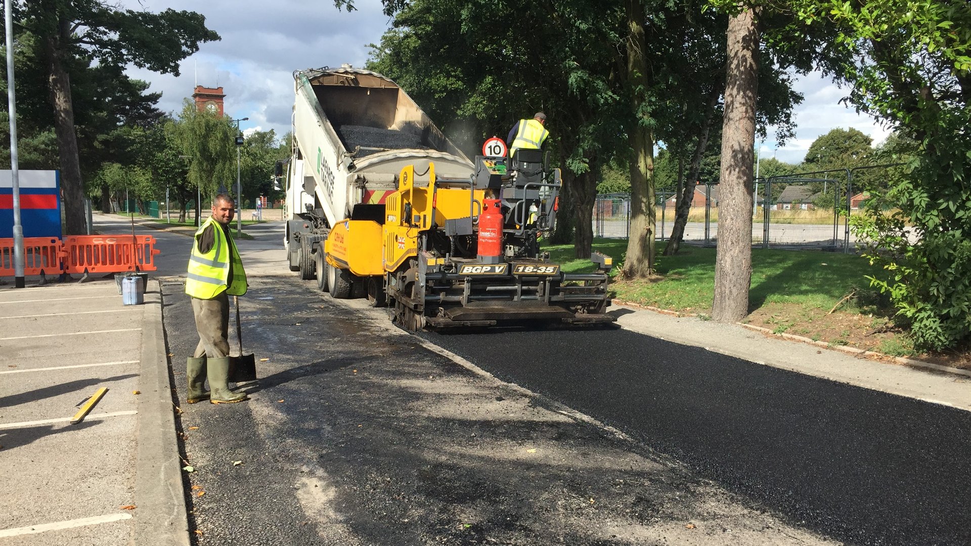 Atkinson Surfacing crew machine-laying asphalt
