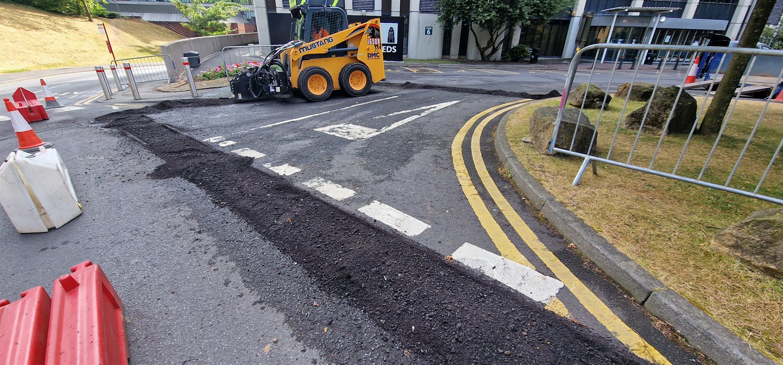 Planing machinery preparing a failed asphalt area for repair