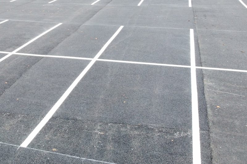 Line-marked finished asphalt surface at Sand Moor Golf Club