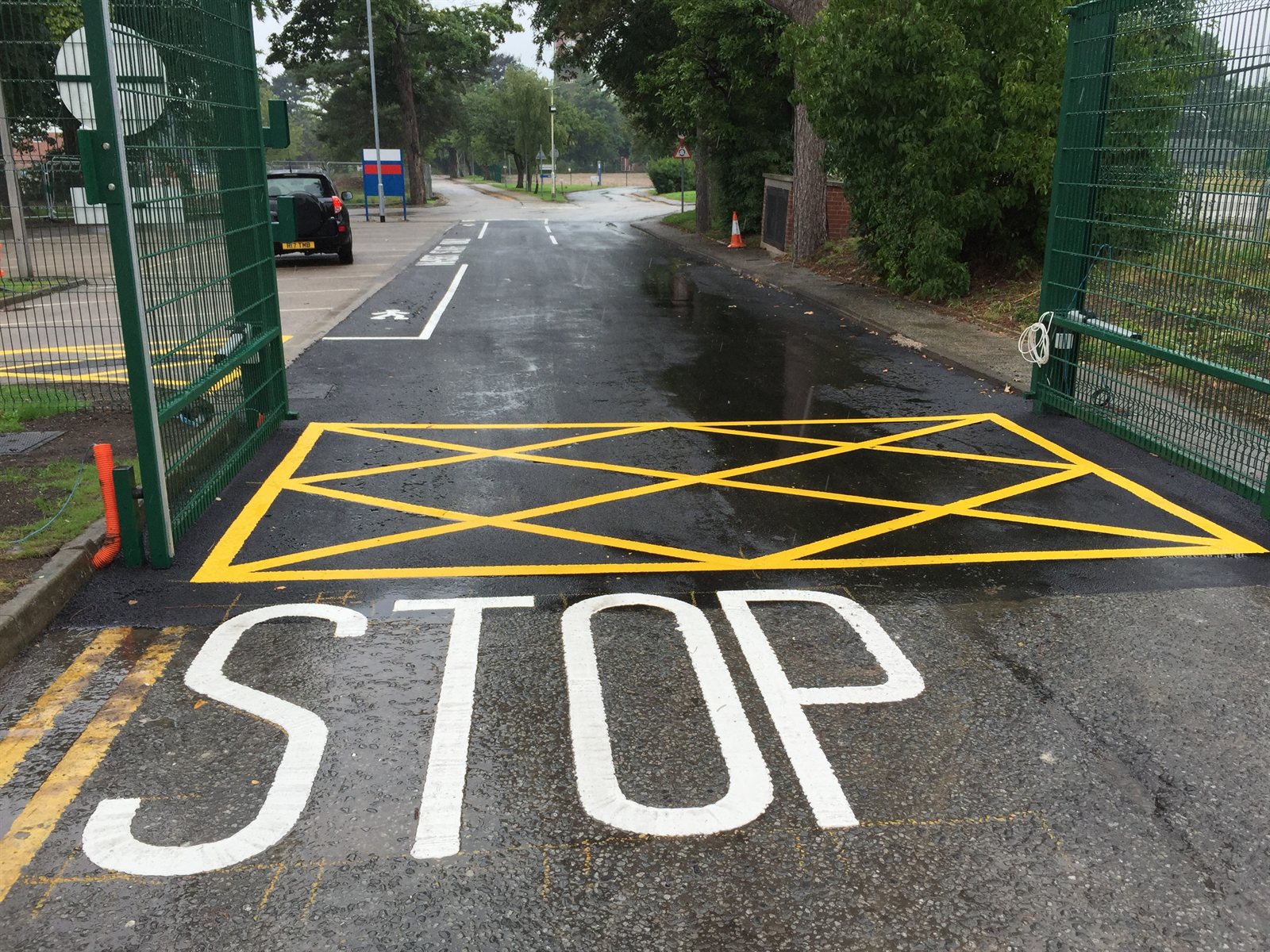 Completed resurfaced access road with fresh line marking