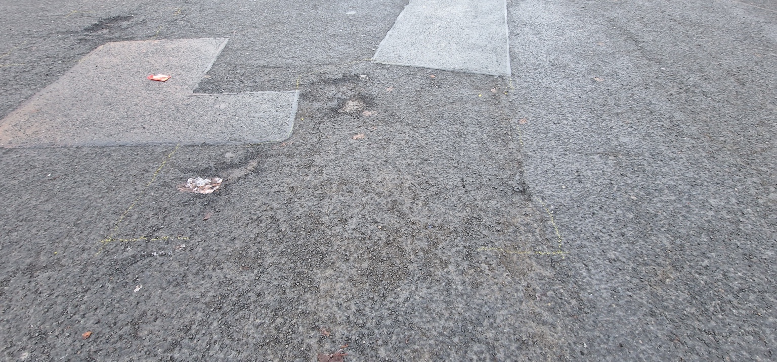 Damaged car park surface in Harrogate before patch repairs