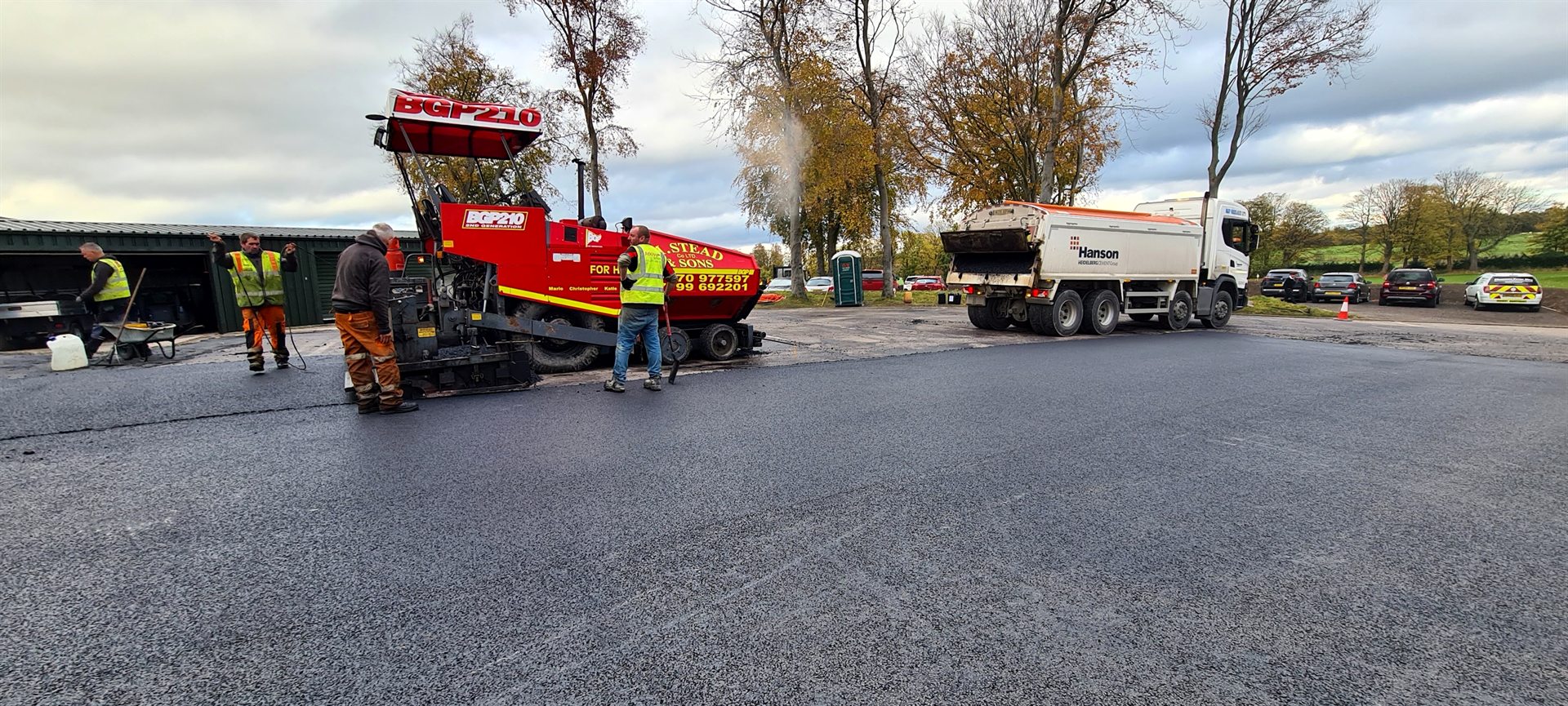 Paver and surfacing crew laying asphalt at Sand Moor Golf Club