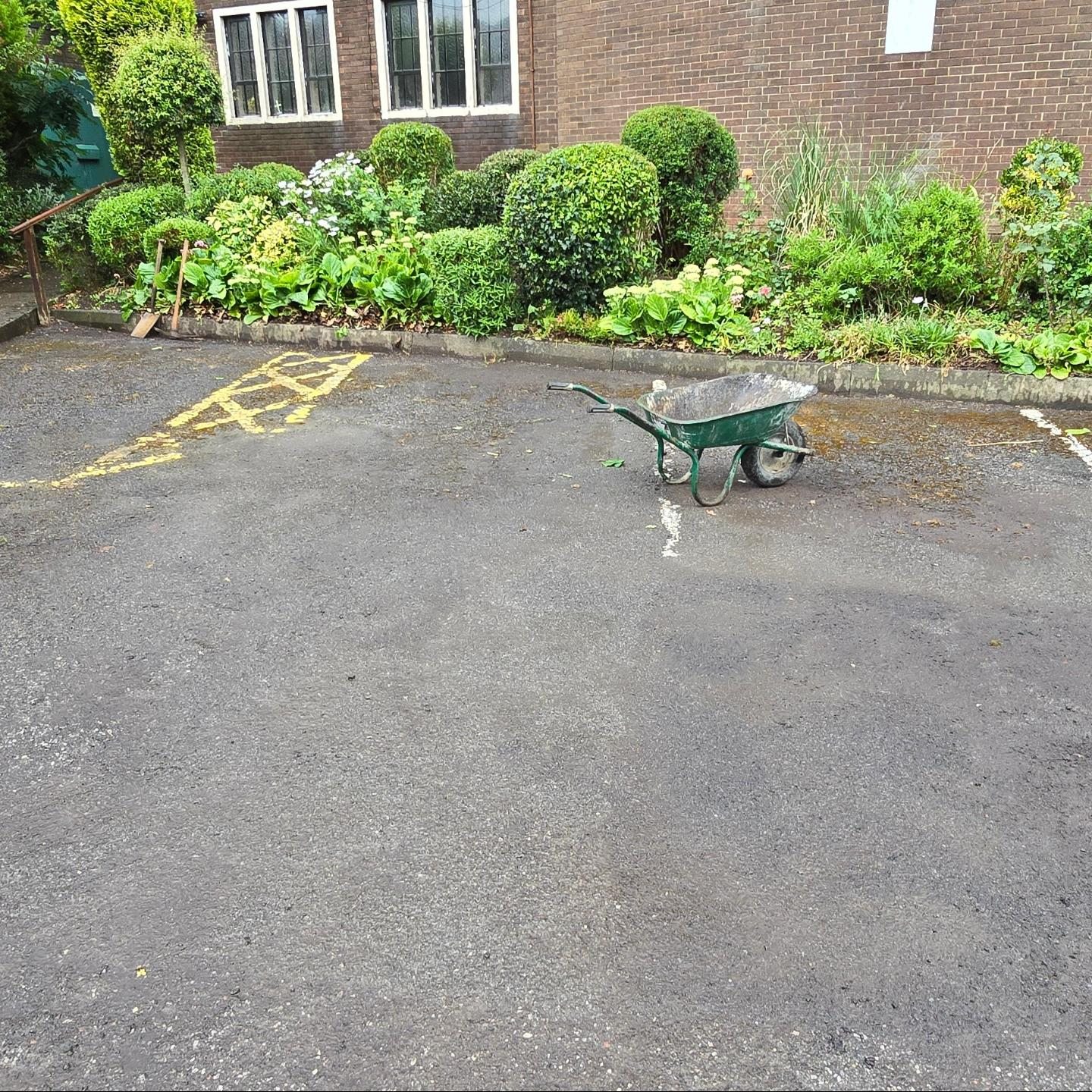 Worn car park surface and faded markings before resurfacing at St Urban's Church
